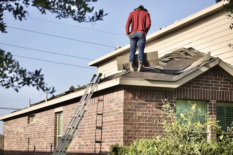 Professional roofer working on a residential roof in Simi Valley Town Center
